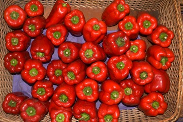 Big red paprika in a wicker basket. 