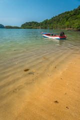 Small boat on the beach in daytime