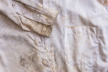 Very rusty messy white color old shirt close up for background use.