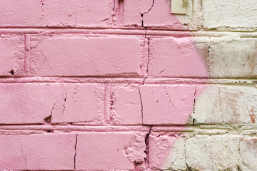 Texture of a brick wall with cracks and scratches which can be used as a background