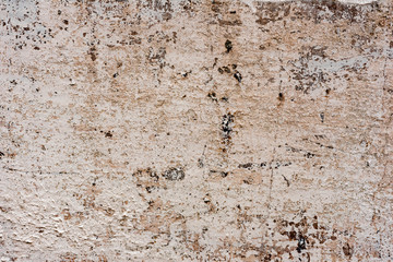 Texture of a concrete wall with cracks and scratches which can be used as a background