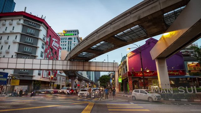 kuala lumpur city center sunset time traffic street crossroad panorama 4k timelapse malaysia 