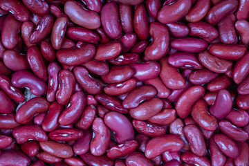 Background of many grains of dried beans. Red beans texture. Food background. Close up. Bean background and texture