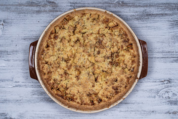 Homemade organic apple pie dessert ready to eat, close up. Apple tart with walnut. Close up