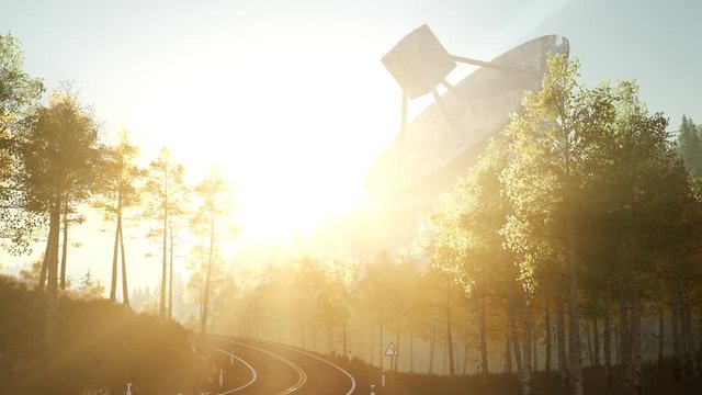 The observatory radio telescope in forest at sunset