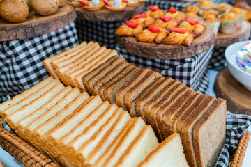 Assortment of fresh bread on table in buffet