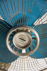 Vintage old white stand fan with blue blades
