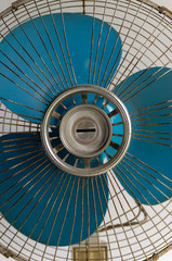 Vintage old white stand fan with blue blades