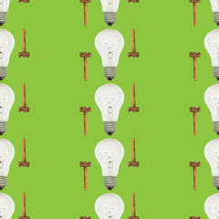 Creative bright seamless pattern of glass bulbs and hammer on a green background