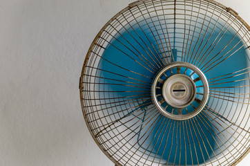 Vintage old white stand fan with blue blades