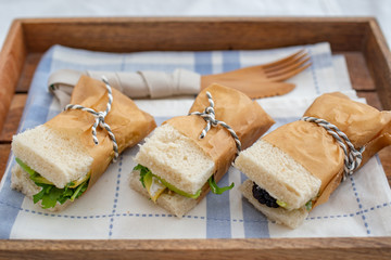 Healthy home made sandwich with avocado, salad and ham