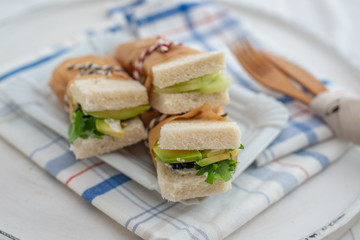 Healthy home made sandwich with avocado, salad and ham