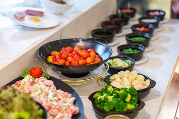 Salad bar with vegetables in the restaurant, healthy food