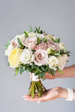 Bridal bouquet with white. Beautiful bouquet of mixed flowers in woman hand. Floral shop concept . Handsome fresh bouquet. Flowers delivery