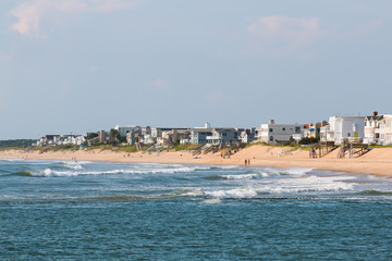 Homes line the Virginia Beach shore near the boardwalk and Rudee Inlet.