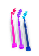Three multi-colored markers on a white background