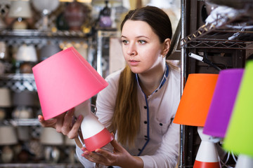 Woman buying new lamp