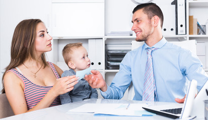 manager of insurance company talking with female