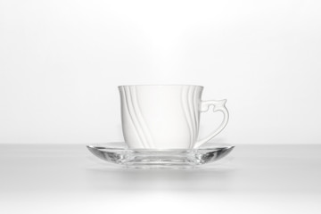 White cup and saucer on a white background