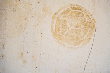 Football print on cement background,soccer slough on wall.
