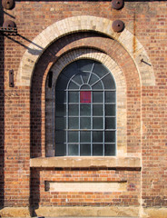Fototapeta na wymiar Old Disused Factory Arch Window