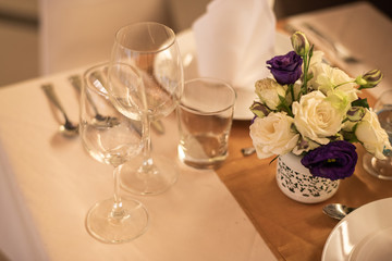 Dinner table setting at a luxury wedding.
