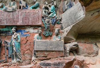 Sculpture depicting Buddhist stories at Dazu Rock Carvings at Mount Baoding or Baodingshan in Dazu, Chongqing, China. UNESCO World Heritage Site.