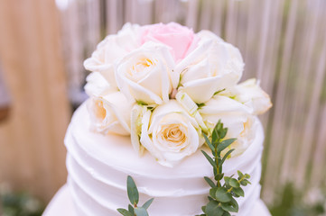 Wedding cake decorated with beautiful flowers.