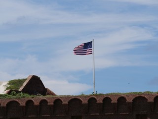 Wide top view of Fort Jefferson, Dry Tortugas National Park, with a United States flag flying from...