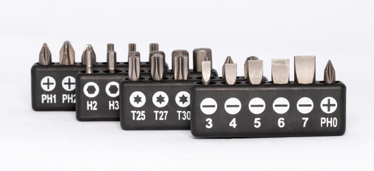 Sets of screwdriver bits (heads, tips)isolated on white background. Label of sizes on package.