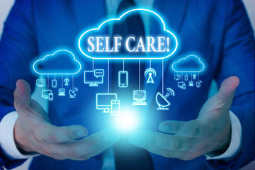 Word writing text Self Care. Business photo showcasing practice of taking action to preserve or improve ones own health Male human wear formal work suit presenting presentation using smart device