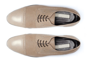 Classic male leather shoes isolated on a white, top view.