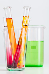 Test flasks with color samples on light grey background