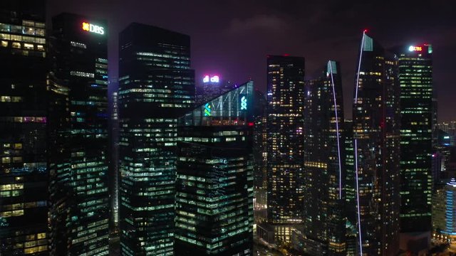 night illumination singapore city downtown aerial panorama 4k 