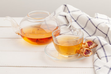 Homemade crunchy cookies and  tea on a wooden table