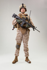 United states Marine Corps special operations command  raider with weapon. Studio shot