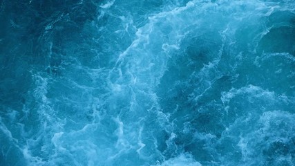 Blue sea water with boat trace. Slow motion.