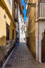 Granada, Spain - narrow street in Albaicin Moorish medieval quarter