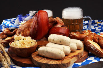 Traditional German cuisine, Schweinshaxe roasted ham hock. Beer, pretzels and various Bavarian specialties. Oktoberfest background
