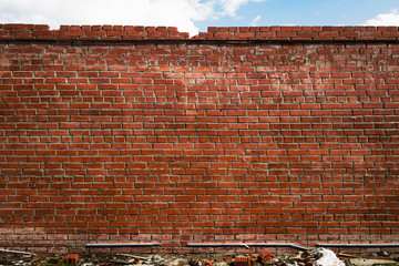 Old brown brick wall. Grunge brick background.