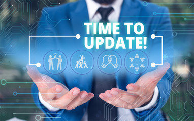 Handwriting text Time To Update. Conceptual photo act updating something someone or updated version program Male human wear formal work suit presenting presentation using smart device
