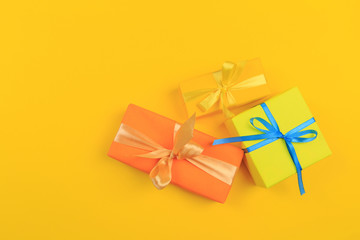 Different colored gift box on color background. Top view of various present boxes on minimal background. Birthday, Christmas, wedding, valentine, romantic gifts - Image