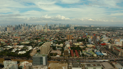 Obraz premium Manila city with skyscrapers, modern buildings and Makati business center, aerial drone. Travel vacation concept.