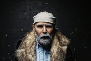 Santa Claus hipster / portrait of a fashionable modern Santa, young man with a gray beard, Christmas winter portrait