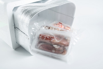 Fresh seafood food in aluminum foil bags
