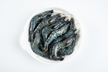 a plate of fresh black prawn on a white background