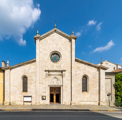 The facade of the beautiful Collegiate Church of Santa Maria Nascente in Arona, Italy, on a sunny day