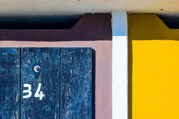 Close up on the texture of  beach cabins' doors on the Adriatic coast in Pesaro, Italy