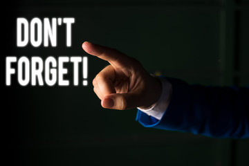 Word writing text Don T Forget. Business photo showcasing used to remind someone about important fact or detail Isolated hand pointing with finger. Business concept pointing finger