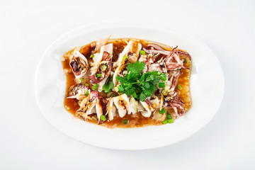 Chinese Cantonese cuisine home cooking, a dish of garlic steamed tubule squid on a white background
